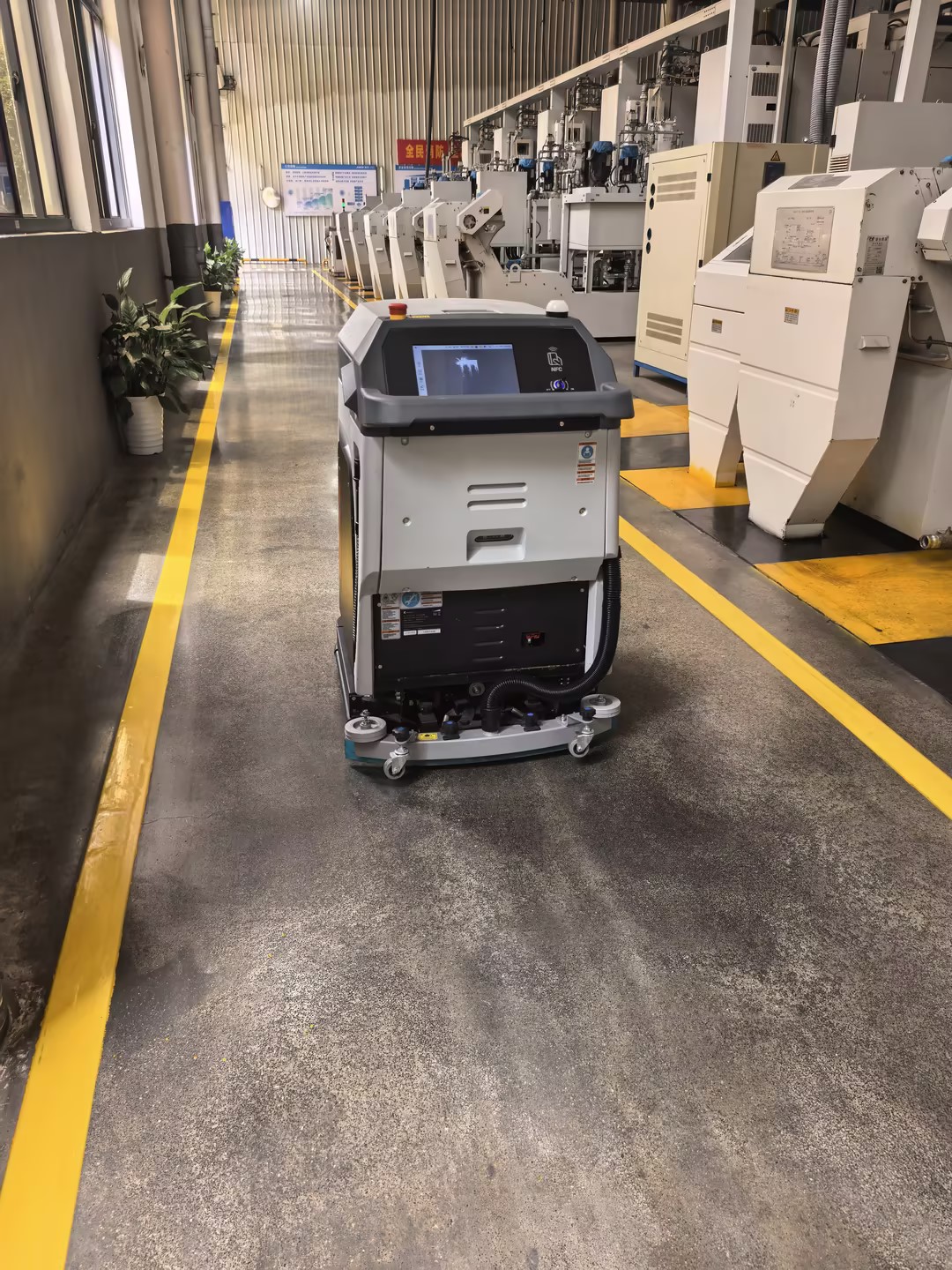 Siben Thunder God GT robot scrubber on dark oil-film factory floor