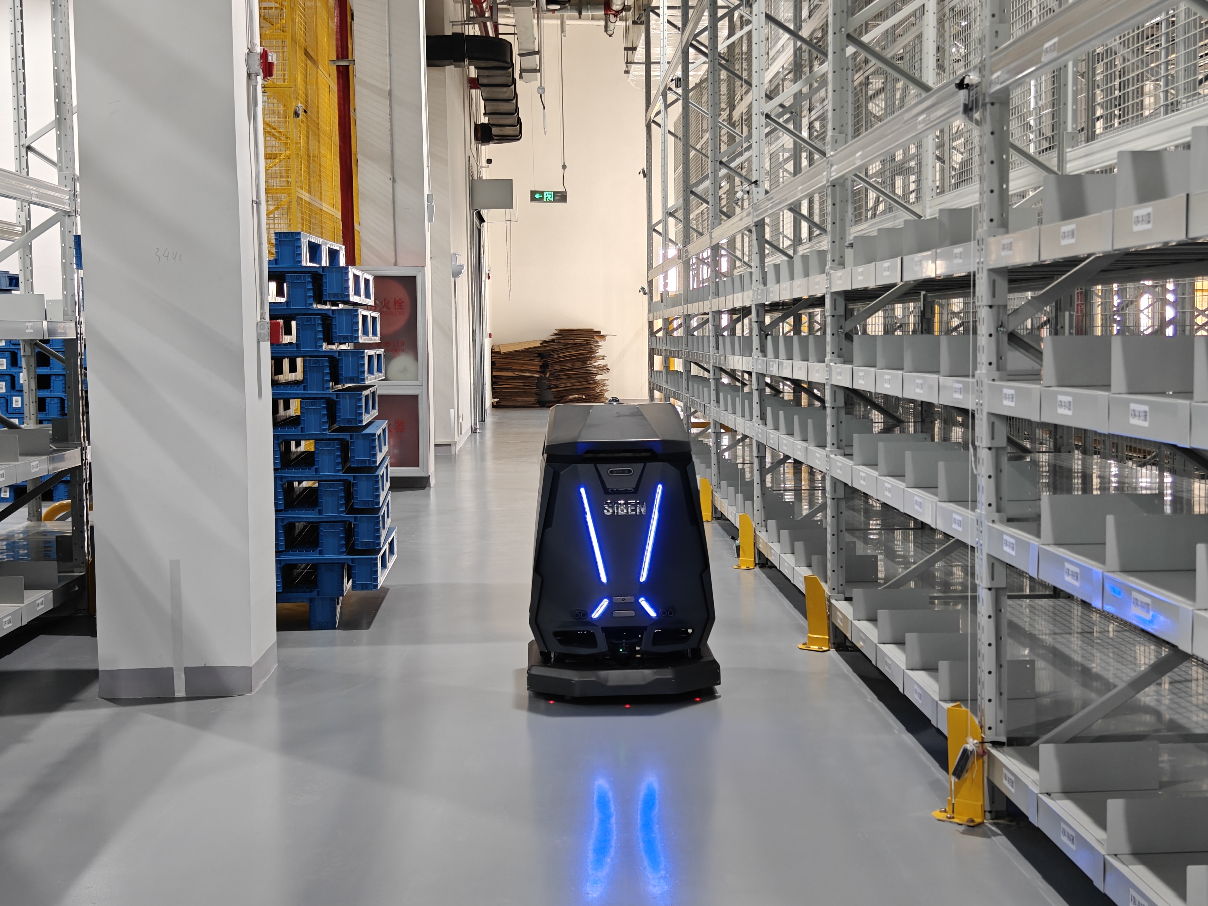 Siben Thunder God robot scrubber on glossy epoxy warehouse floor
